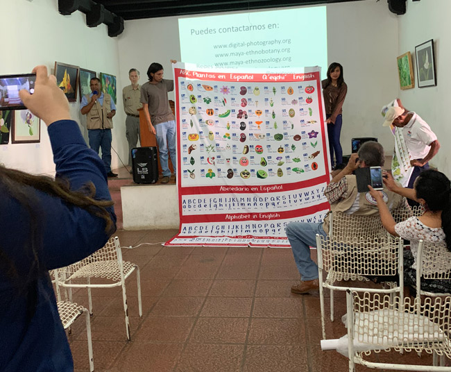 Nicholas and Senaida showing MayanToons educational material from FLAAR Mesoamerica